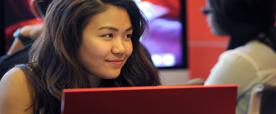 A female student at a laptop