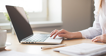 A student using a laptop.