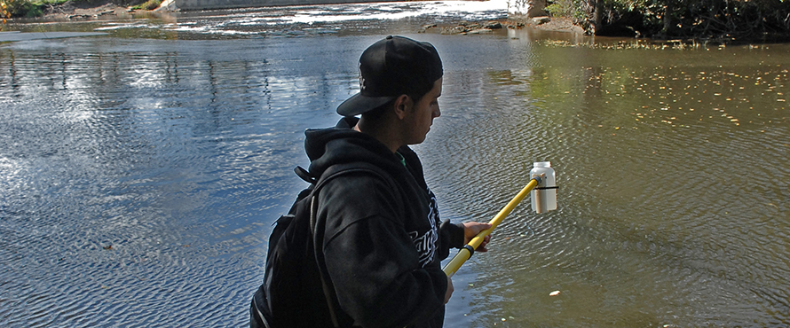 Earth Science student taking water samples