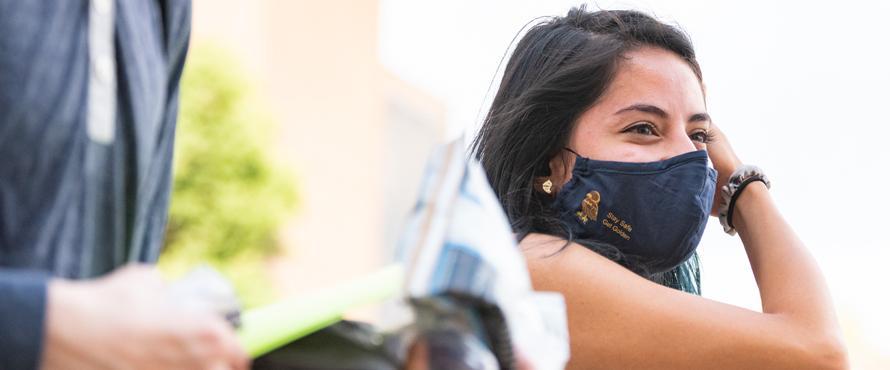 Student wearing a Northeastern face mask