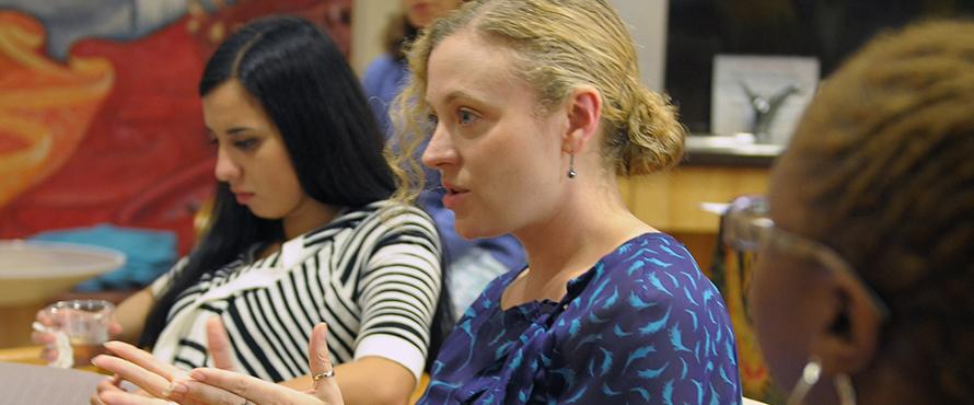 A woman speaking during a classroom discussion