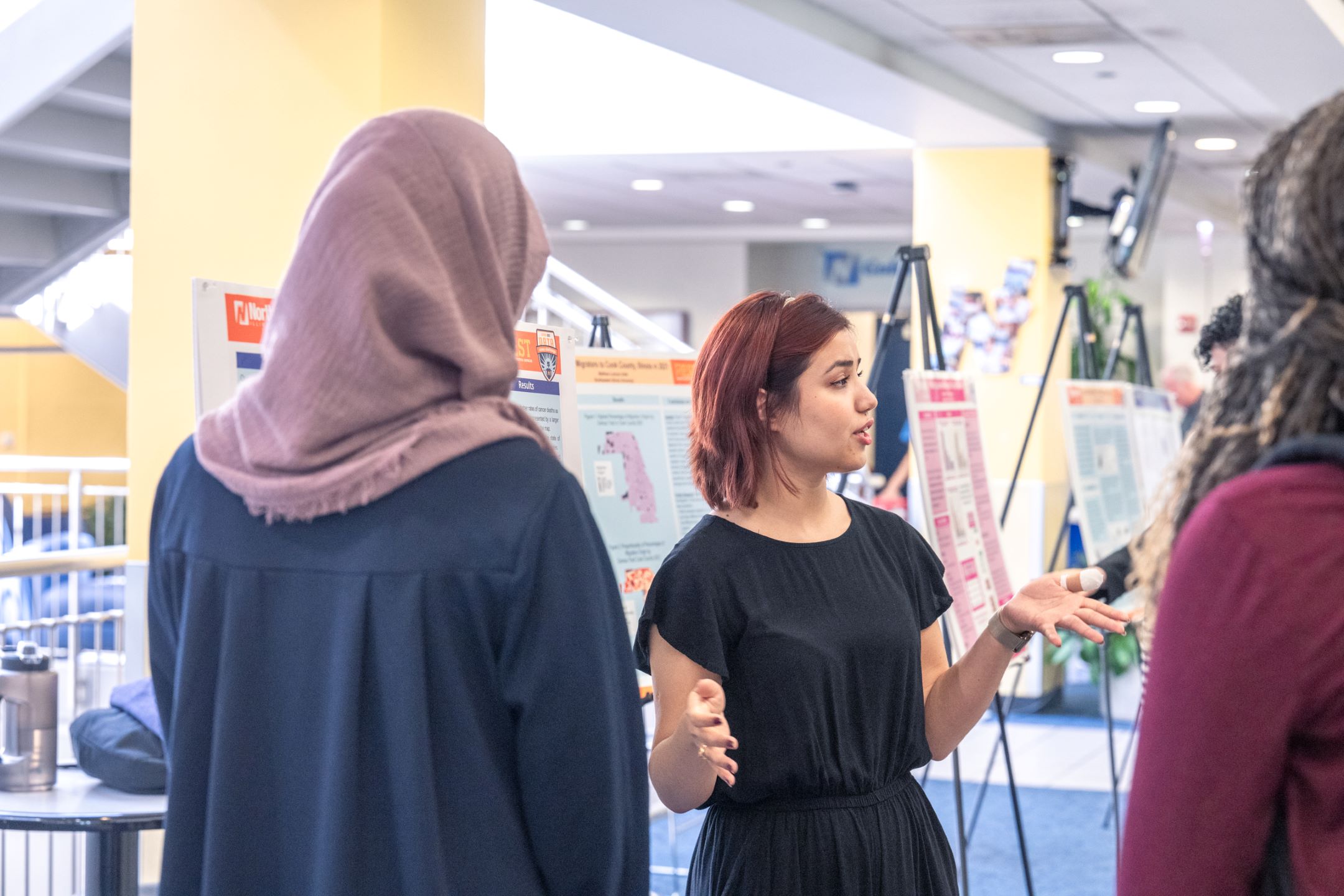 a student presenting a poster