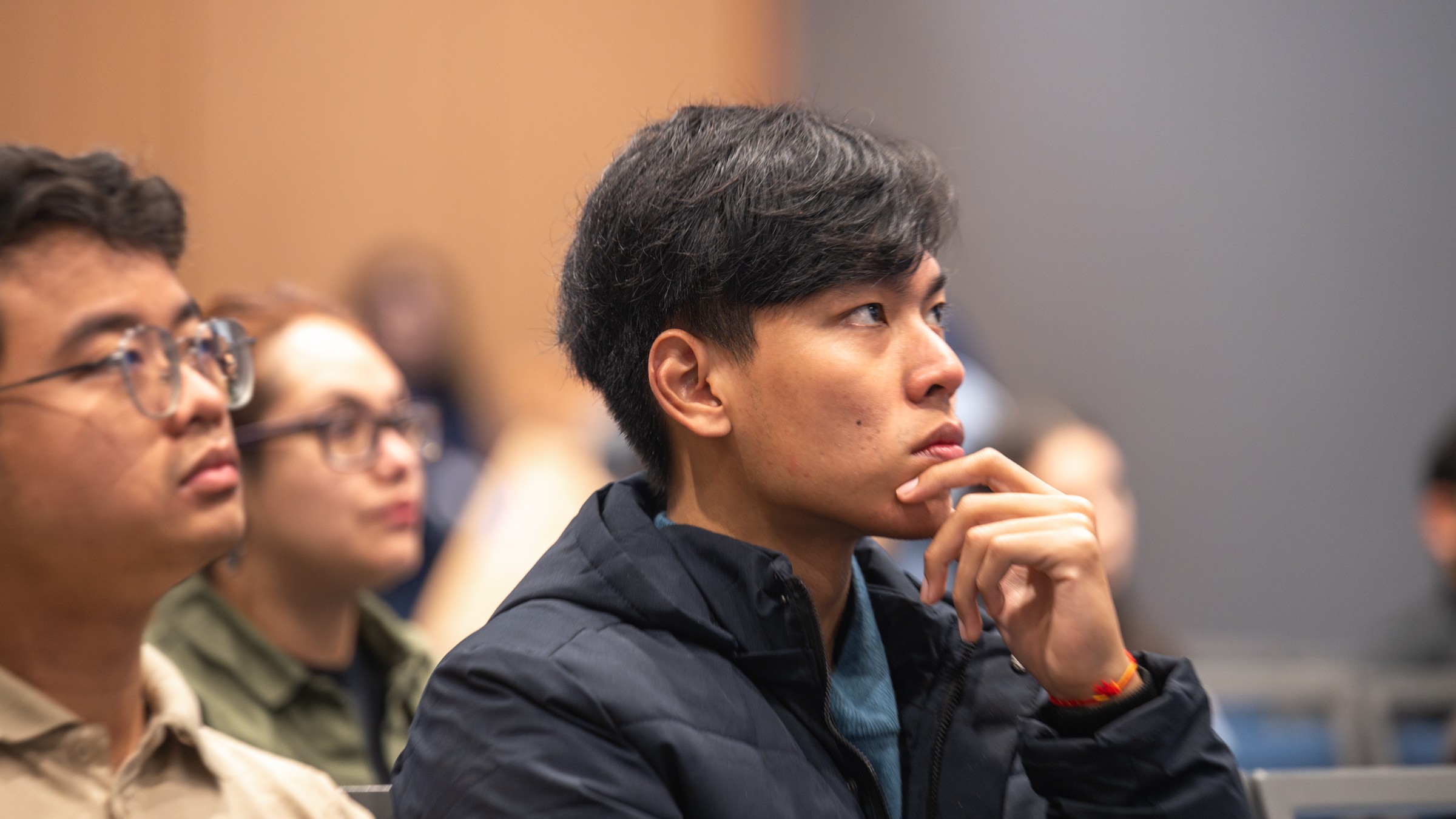 A student seated in a classroom