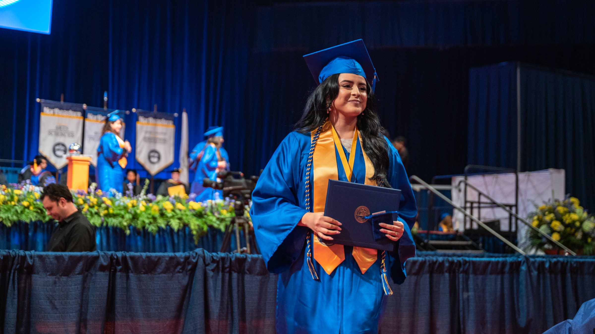 Student walking during the commencement ceremony 