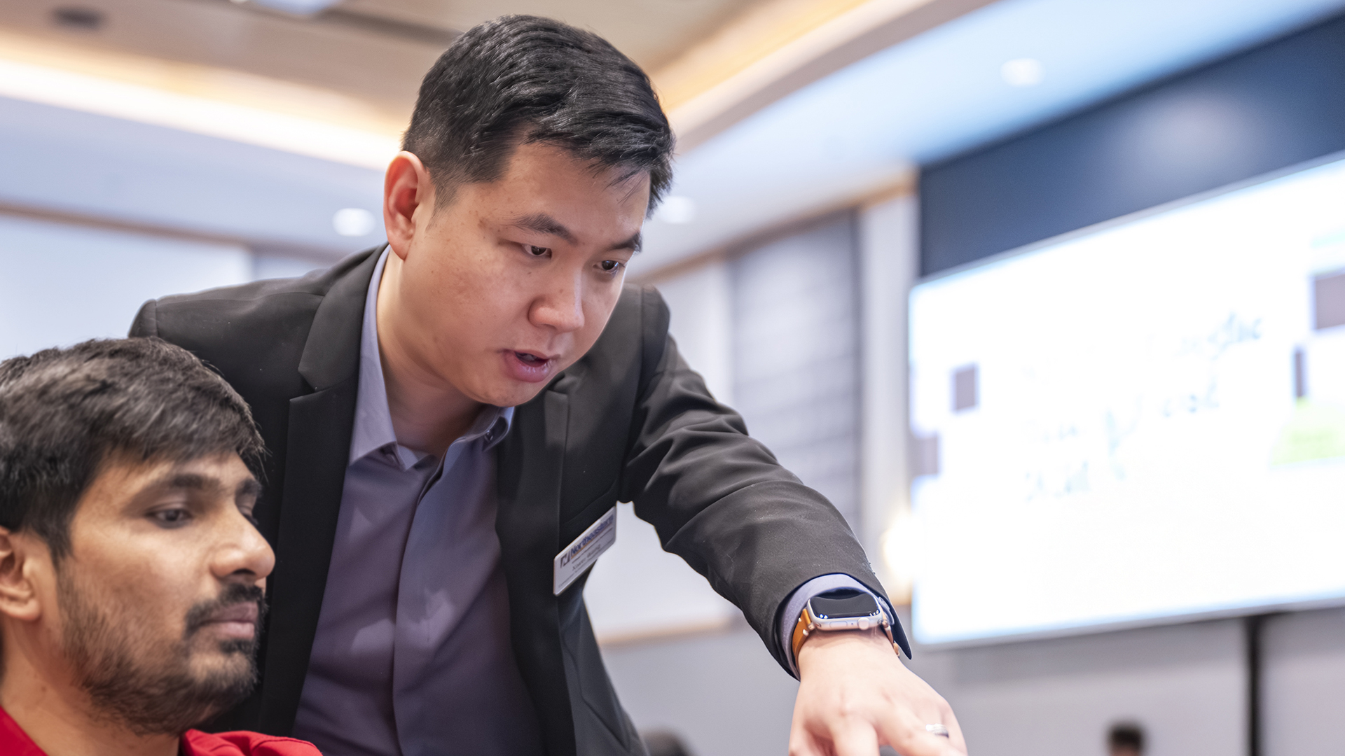 Xiwei Wang working with a student