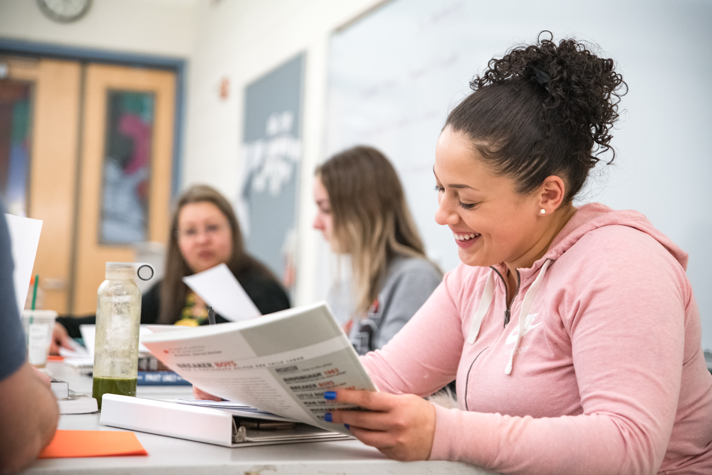 Students working together in a classroom. 
