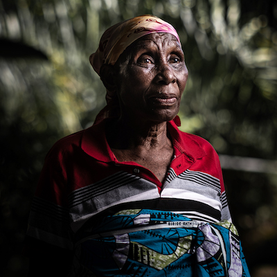 Cecile Nskerabandya witnessed militia forcefully take all the educated male members of her community out of their homes in Buhonga, a small village tucked away in Burundi’s mountains. Her brother and father were killed during the 1972 genocide in Burundi. Photo by Viktor Gerasimovski.