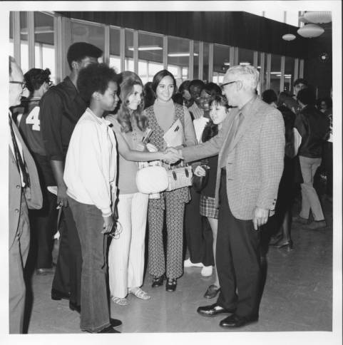 Northeastern President Jerome Sachs greets students in the cafeteria in the late 1960s or early 1970s.