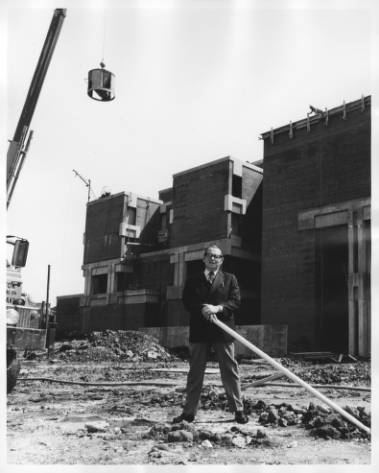 President James Mullen poses outside of the Science Building during its construction in the early 1970s.