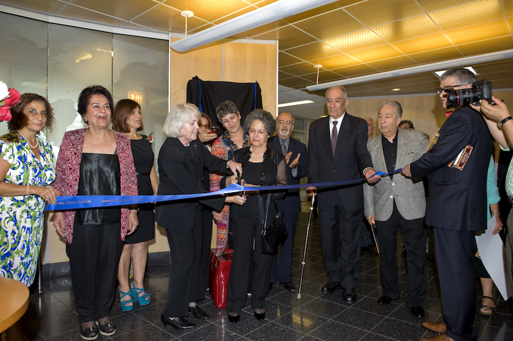 President Emerita Sharon Hahs cuts the ribbon at the Mossadegh Servant Leaders Hall dedication Oct. 5, 2013