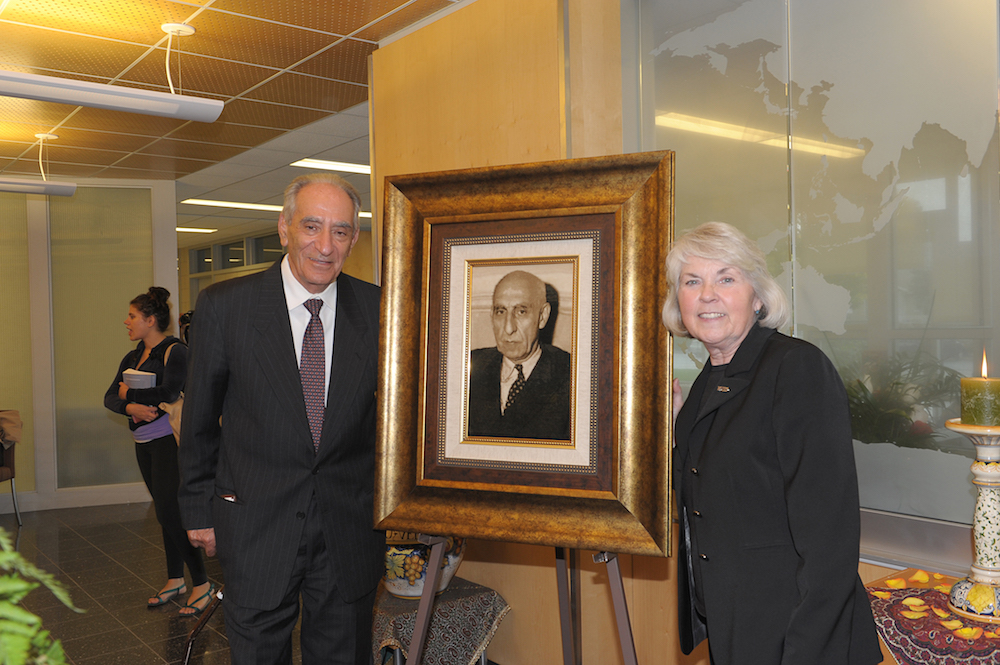 Ghobad Fakhimi and Dr. Hahs with the woven carpet of Mossadegh’s portrait