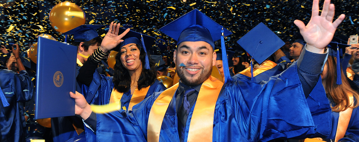 Confetti drop at Commencement with students in foreground.