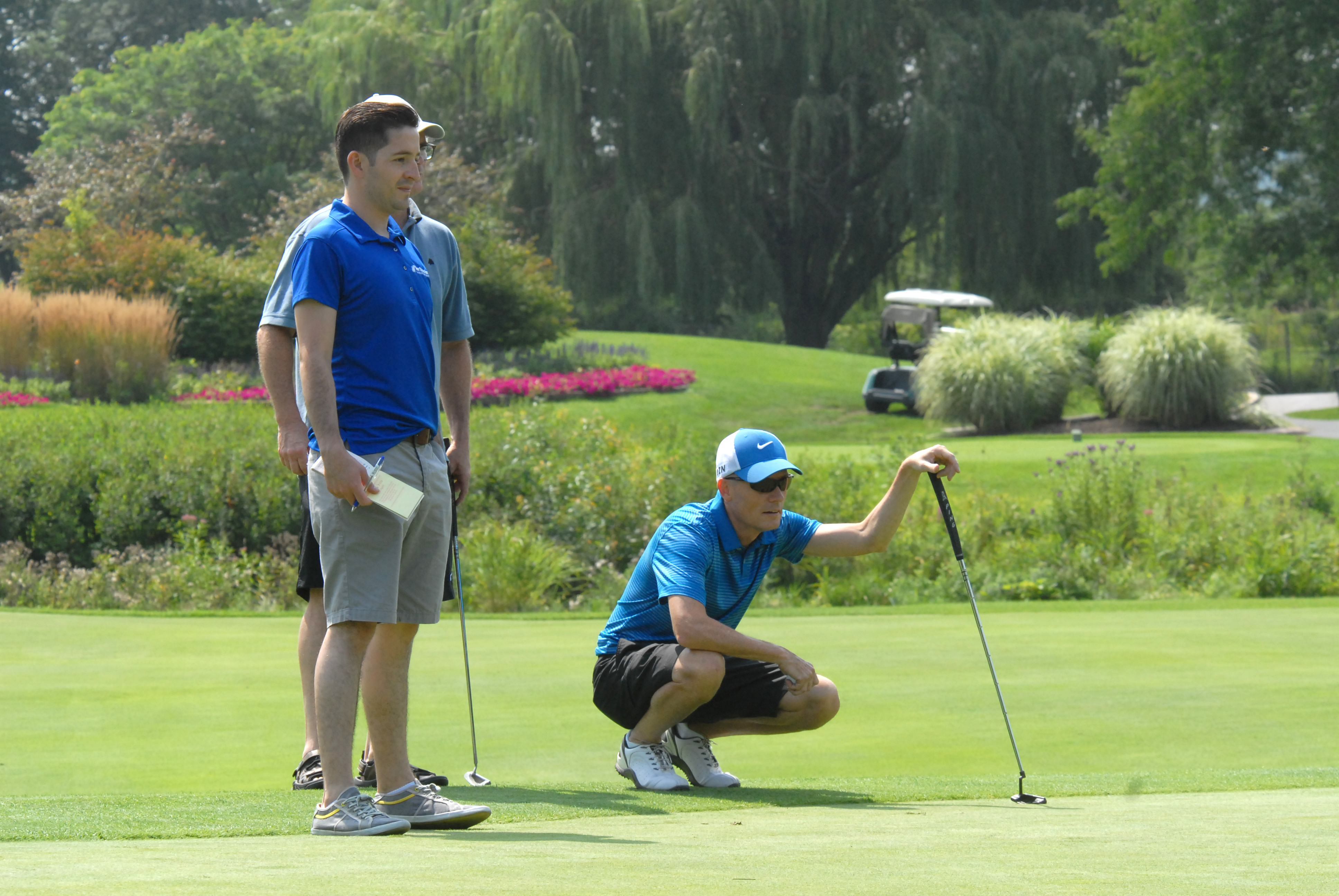 John G. Findley lines up a putt at the Chuck Kane Scholarship Golf Event on Aug. 18, 2014.