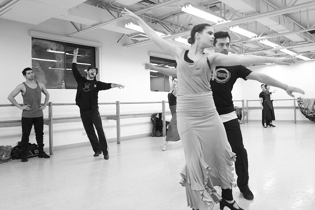 Guest choreographers Carlos Rodriguez (far left) and Angel Rojas work with dancers Abigail Ventura and Juan Carlos Castellon during rehearsals for “Iroko.”