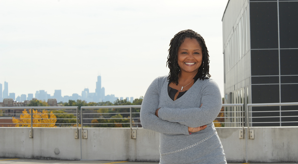 Alicia Ozier on the roof of the Parking Facility with Chicago skyline in background