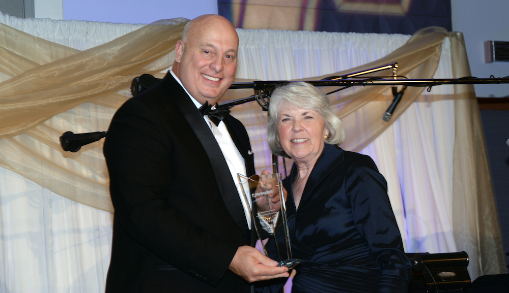 President Sharon Hahs presents Thomas White with the Distinguished Alumnus Award during the Golden Gala on Sept. 17, 2016
