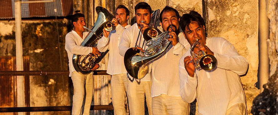 M5 Mexican Brass Band members playing brass instruments