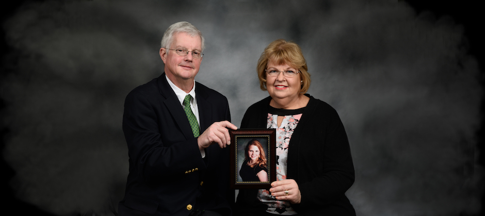 John and Eileen Kelly hold a photo of their daughter, Katie Kelly.