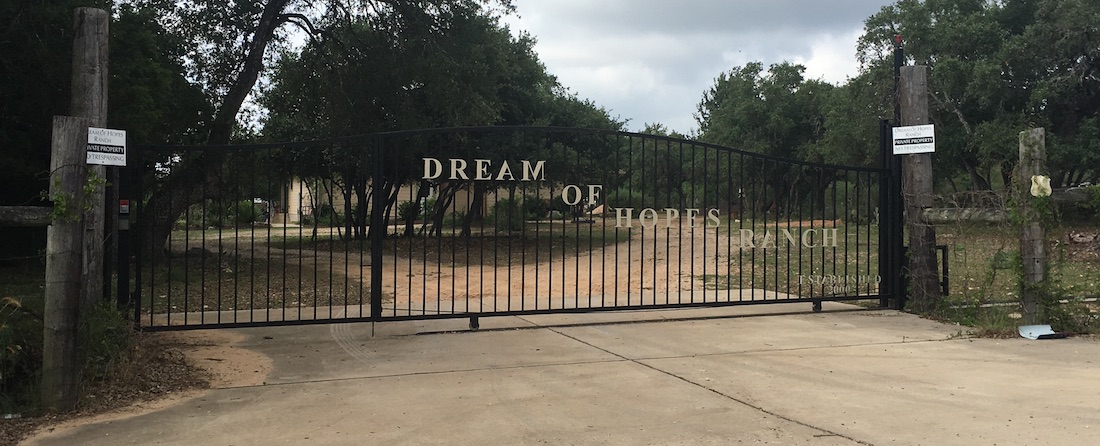 The front gate of Dream of Hopes Ranch.