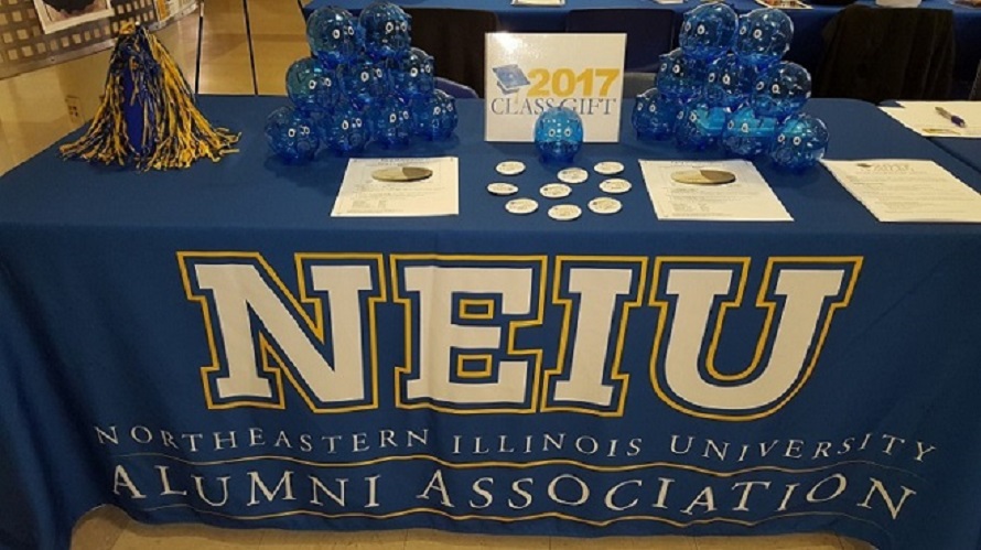 NEIU is shown on a blue tablecloth.