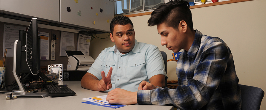 Staff member advising a student