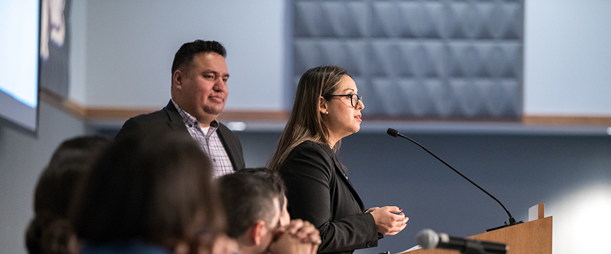 Luvia Moreno speaking at an event.