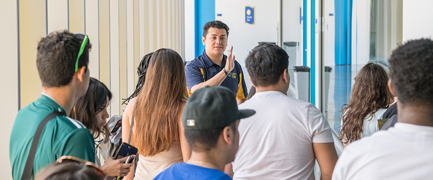 Male student leading a group tour at El Centro