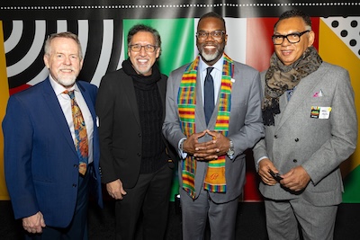 A photo of Jorge Pérez next to Chicago Mayor Brandon Johnson (center).