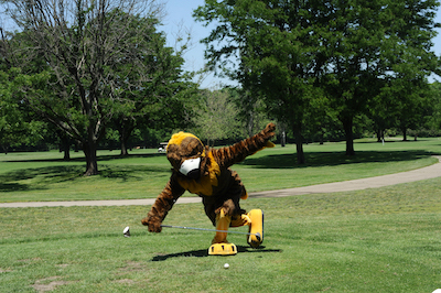 Mascot Goldie the Golden Eagle on a golf green