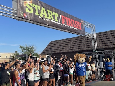 A photo of runners at the start/finish line of the 2025 Corrida del Mariachi.