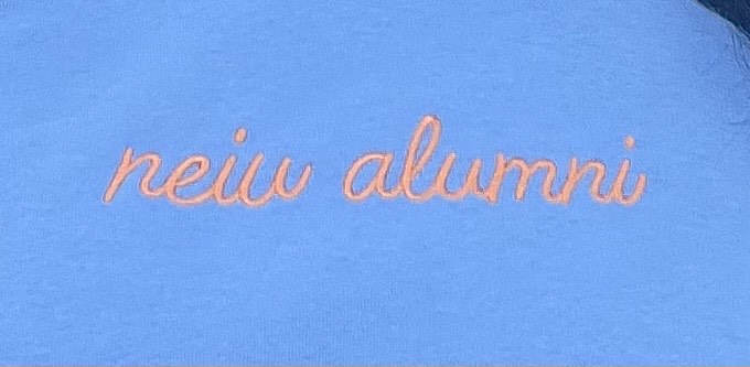 neiu alumni in cursive, golden writing