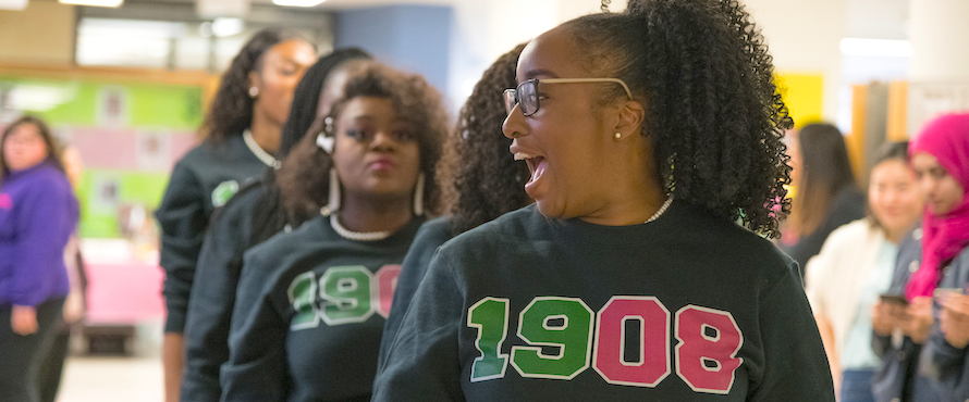 A photo of students from Alpha Kappa Alpha Sorority, Inc. during a student fair in Village Square.