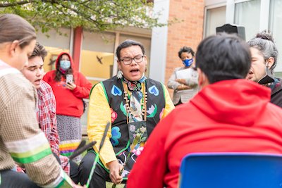 A photo of Native American drum and dance group Shki Bmaadzi performing at NEIU on Nov. 3.