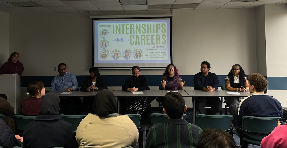 Students listening to a panel discussion