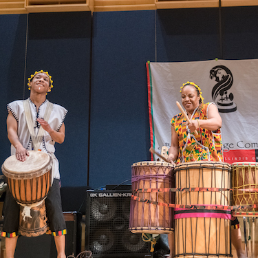 A photo of two drummers at a Harambee event organized by the Black Heritage Committee. 