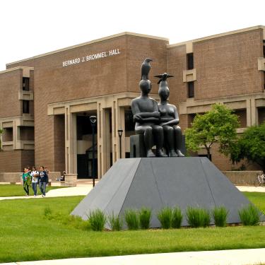 The eastern exterior of Bernard Brommel Hall with the Serenity sculpture in the foreground
