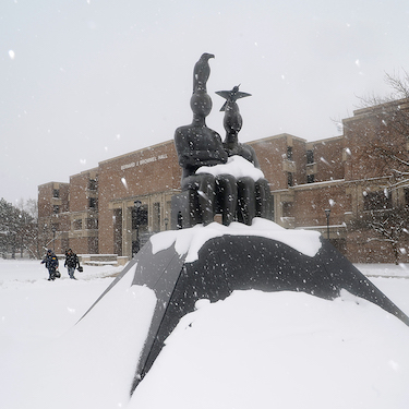Ruth Duckworth's Serenity sculpture sits dusted with snow to the north of Bernard Brommel Hall