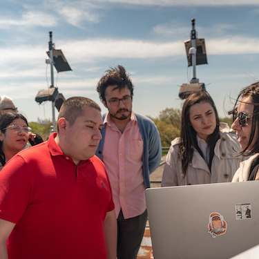 A photo of Northeastern students meeting with a member of Argonne National Laboratory's CROCUS grant on May 5, 2023.