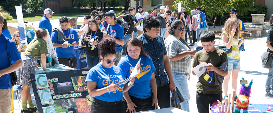 Students gather outdoors during Golden Eagle Welcome Day