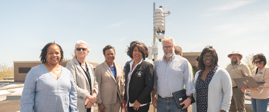 A photo of members of the Northeastern and Argonne National Laboratory CROCUS grant with President Gloria J. Gibson during the installation of scientific equipment on the roof of Brommel Hall on May 5, 2023.