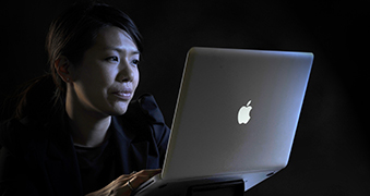 Woman looking at her computer.