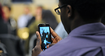 Student looking at cell phone