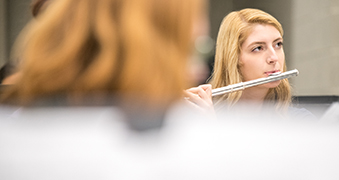 A student playing the flute.
