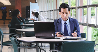 Male student working on his computer