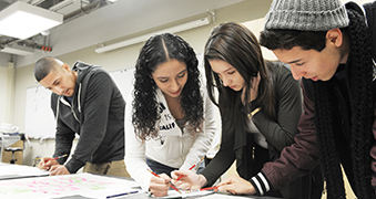 Students collaborating on a project in class.