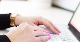 A student using a laptop.