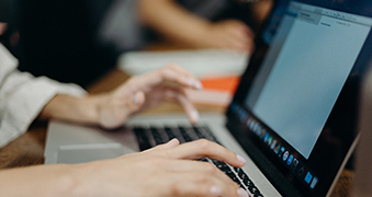 A student using a laptop.