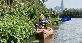 Woman riding in a canoe.