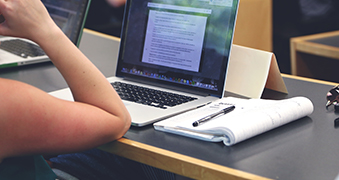 A student using a laptop.