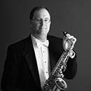 professional photo of Andrew Carpenter with Saxophone
